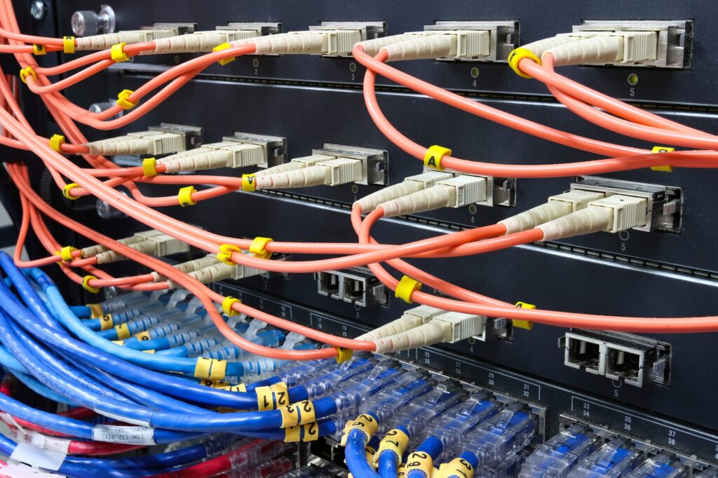 cable network, fiber optic cable connect to switch port in server room